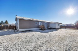 Back of property featuring a fenced backyard - 