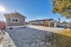 View of property exterior with a storage unit - 