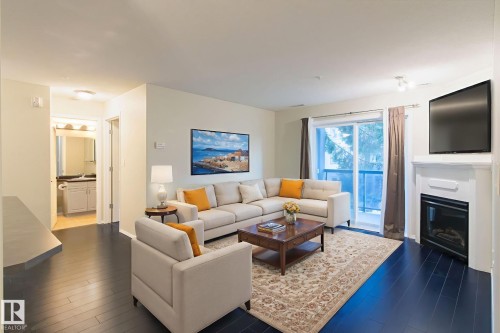 239 279 Suder Greens Drive, Edmonton, AB - Indoor Photo Showing Living Room With Fireplace