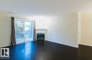 239 279 Suder Greens Drive, Edmonton, AB  - Indoor Photo Showing Living Room With Fireplace 