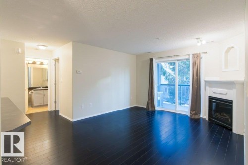 239 279 Suder Greens Drive, Edmonton, AB - Indoor Photo Showing Living Room With Fireplace