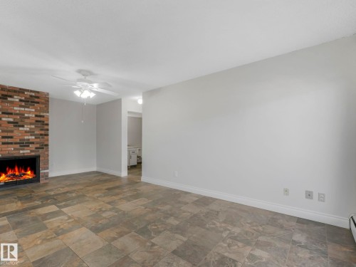 3 10836 116 Street, Edmonton, AB - Indoor Photo Showing Other Room With Fireplace
