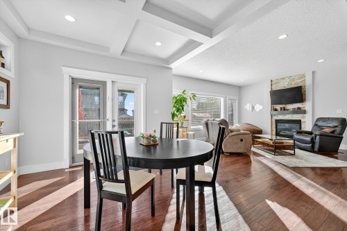 1 Wembley, Fort Saskatchewan, AB - Indoor Photo Showing Dining Room With Fireplace