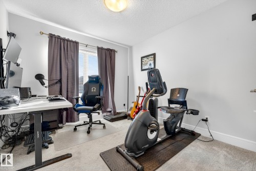 1 Wembley, Fort Saskatchewan, AB - Indoor Photo Showing Gym Room