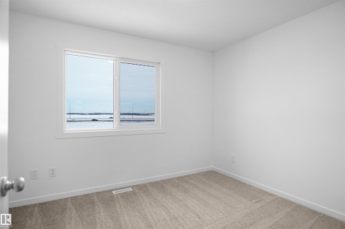 124 1009 Cy Becker Road, Edmonton, AB - Indoor Photo Showing Other Room
