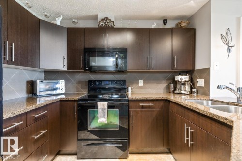 115 2208 44 Avenue, Edmonton, AB - Indoor Photo Showing Kitchen With Double Sink