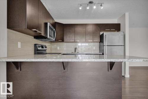 219 14808 125 Street, Edmonton, AB - Indoor Photo Showing Kitchen With Upgraded Kitchen