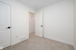 Unfurnished bedroom featuring baseboards and light colored carpet - 