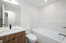 Bathroom with vanity,  shower combination, and recessed lighting - 