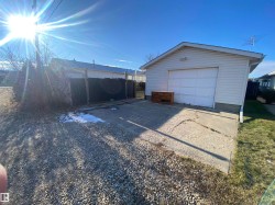 Detached garage with concrete driveway - 