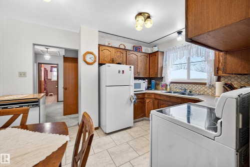 5607 97 Avenue, Edmonton, AB - Indoor Photo Showing Kitchen With Double Sink