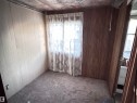 Empty room with wood walls and carpet flooring - 4748 50 St., Vimy, AB  - Indoor Photo Showing Other Room 