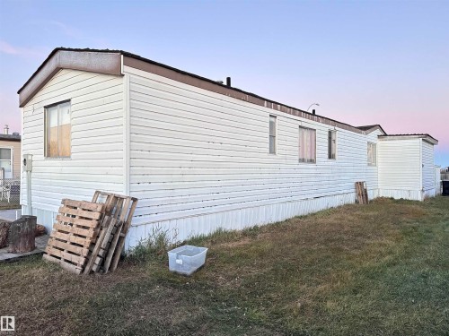 View of side of property with a yard - 4748 50 St., Vimy, AB - Outdoor