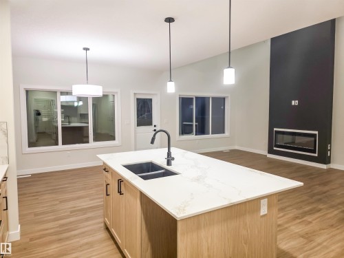 6 Elis Link, Spruce Grove, AB - Indoor Photo Showing Kitchen With Fireplace With Double Sink With Upgraded Kitchen