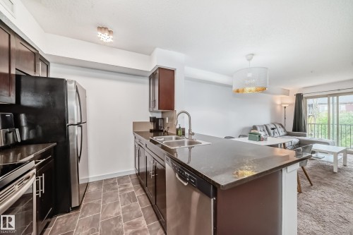 303 1070 Mcconachie Blvd, Edmonton, AB - Indoor Photo Showing Kitchen With Stainless Steel Kitchen With Double Sink