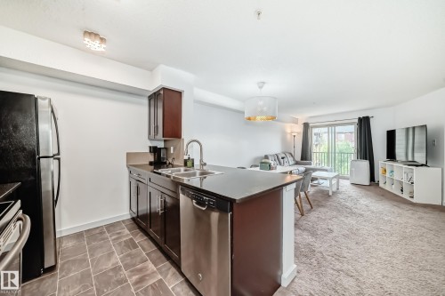 303 1070 Mcconachie Blvd, Edmonton, AB - Indoor Photo Showing Kitchen With Stainless Steel Kitchen With Double Sink
