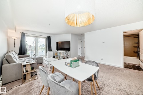 303 1070 Mcconachie Blvd, Edmonton, AB - Indoor Photo Showing Living Room