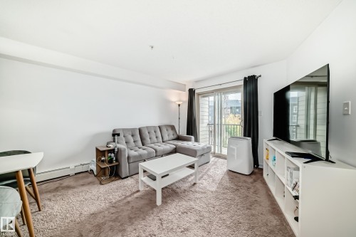 303 1070 Mcconachie Blvd, Edmonton, AB - Indoor Photo Showing Living Room
