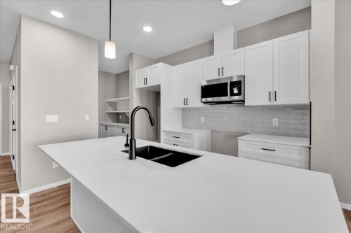 1152 South Creek Wynd, Stony Plain, AB - Indoor Photo Showing Kitchen With Double Sink With Upgraded Kitchen