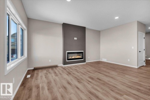 1152 South Creek Wynd, Stony Plain, AB - Indoor Photo Showing Other Room With Fireplace
