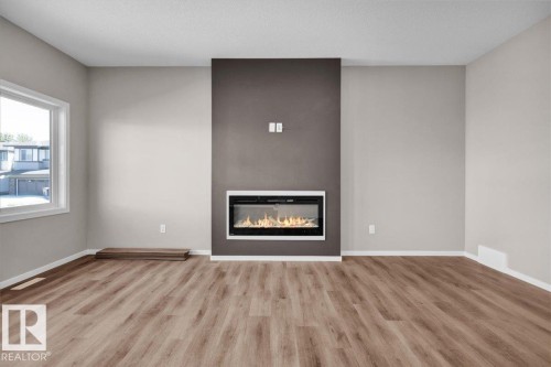 1152 South Creek Wynd, Stony Plain, AB - Indoor Photo Showing Living Room With Fireplace