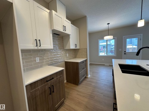 1152 South Creek Wynd, Stony Plain, AB - Indoor Photo Showing Kitchen With Double Sink