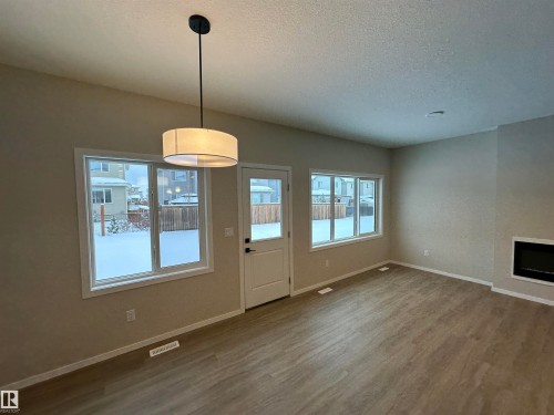 1152 South Creek Wynd, Stony Plain, AB - Indoor Photo Showing Other Room With Fireplace