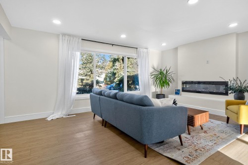 11155 37 Avenue, Edmonton, AB - Indoor Photo Showing Living Room With Fireplace