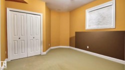 Unfurnished bedroom featuring carpet and a closet - 