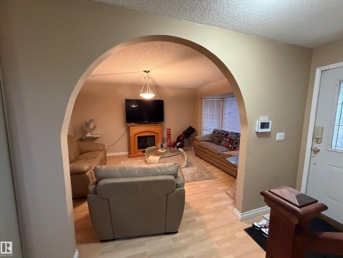 3841 62 Street Nw, Edmonton, AB - Indoor Photo Showing Other Room With Fireplace