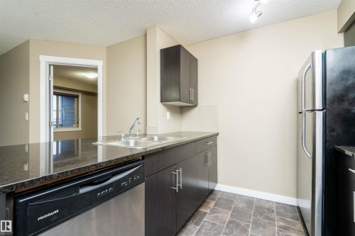 304 5390 Chappelle Road, Edmonton, AB - Indoor Photo Showing Kitchen With Double Sink