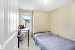 Bedroom with carpet and a textured ceiling - 