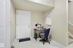 Home office with baseboards and light tile patterned floors - 