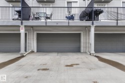 Garage featuring driveway - 