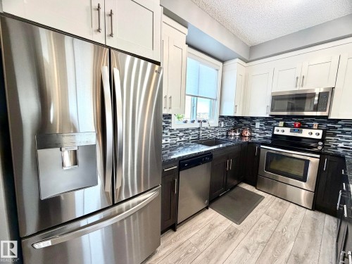 118 16903 68 Street, Edmonton, AB - Indoor Photo Showing Kitchen With Stainless Steel Kitchen With Upgraded Kitchen