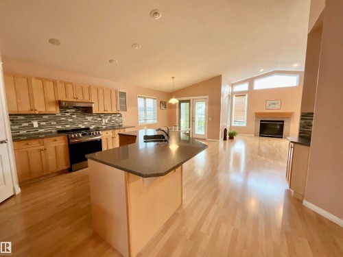 1248 Ormsby Lane, Edmonton, AB - Indoor Photo Showing Kitchen With Fireplace