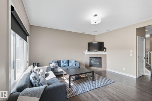 8039 18 Avenue, Edmonton, AB - Indoor Photo Showing Living Room With Fireplace