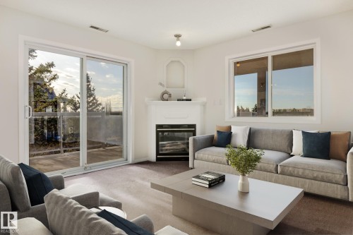 443 279 Suder Greens Drive, Edmonton, AB - Indoor Photo Showing Living Room With Fireplace