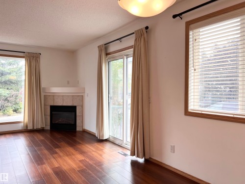 19 10909 106 Street, Edmonton, AB - Indoor Photo Showing Living Room With Fireplace