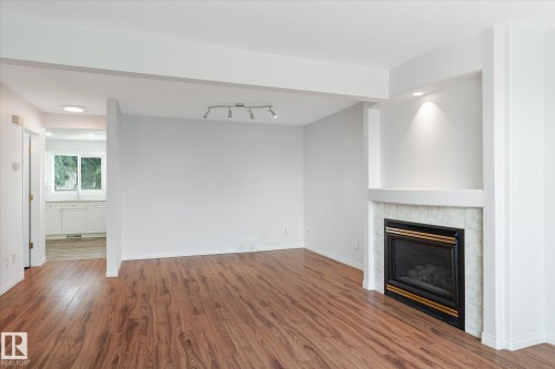 52 9630 176 Street, Edmonton, AB - Indoor Photo Showing Living Room With Fireplace
