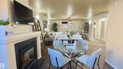 13023 35 Street, Edmonton, AB - Indoor Photo Showing Dining Room With Fireplace
