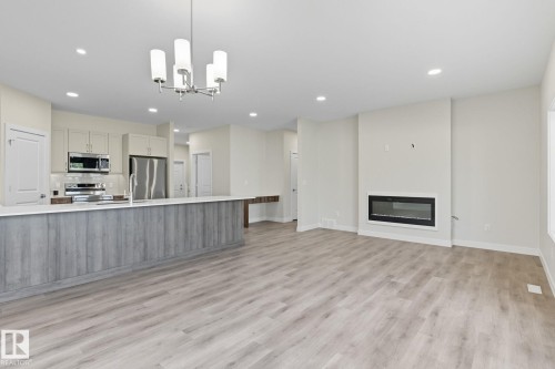 42 11 Dalton Link, Spruce Grove, AB - Indoor Photo Showing Kitchen With Fireplace