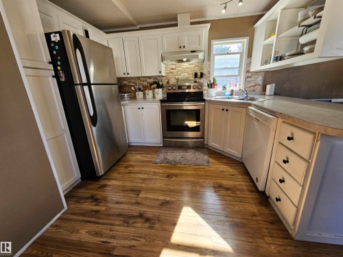84 305 Calahoo Road, Spruce Grove, AB - Indoor Photo Showing Kitchen With Double Sink