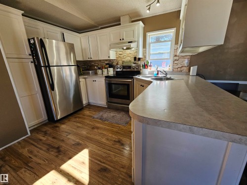 84 305 Calahoo Road, Spruce Grove, AB - Indoor Photo Showing Kitchen With Double Sink