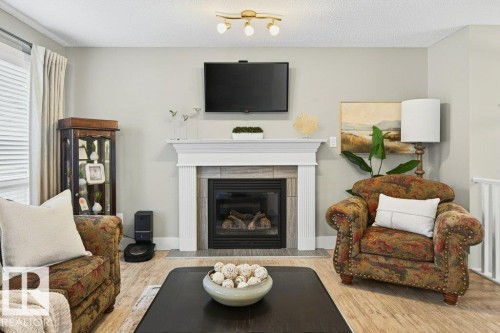 68 Ravine Drive, Devon, AB - Indoor Photo Showing Living Room With Fireplace