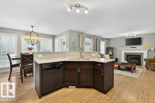 68 Ravine Drive, Devon, AB - Indoor With Fireplace
