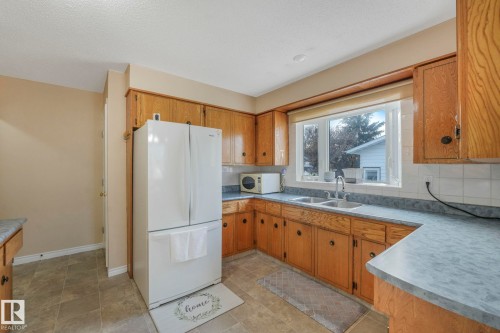 5107 56 Avenue, Leduc, AB - Indoor Photo Showing Kitchen With Double Sink