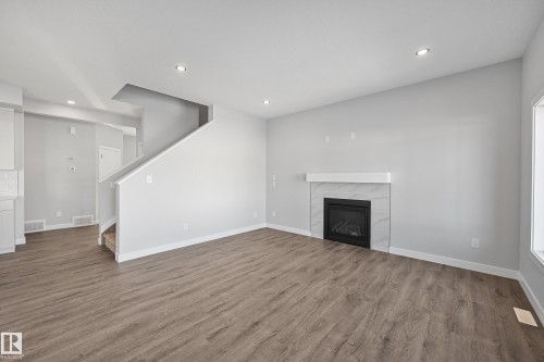 76 Maple Crescent, Gibbons, AB - Indoor Photo Showing Other Room With Fireplace