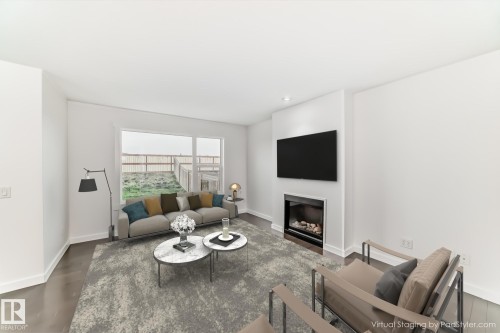 359 Simmonds Way, Leduc, AB - Indoor Photo Showing Living Room With Fireplace