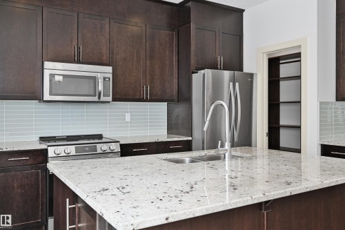 7506 May Common, Edmonton, AB - Indoor Photo Showing Kitchen With Double Sink With Upgraded Kitchen